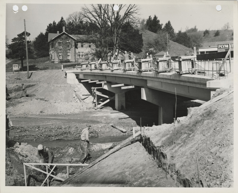 Photograph of people working on the construction of a bridge in Muscatine County