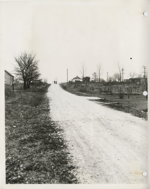 Photograph of people surfacing a street in Bettendorf