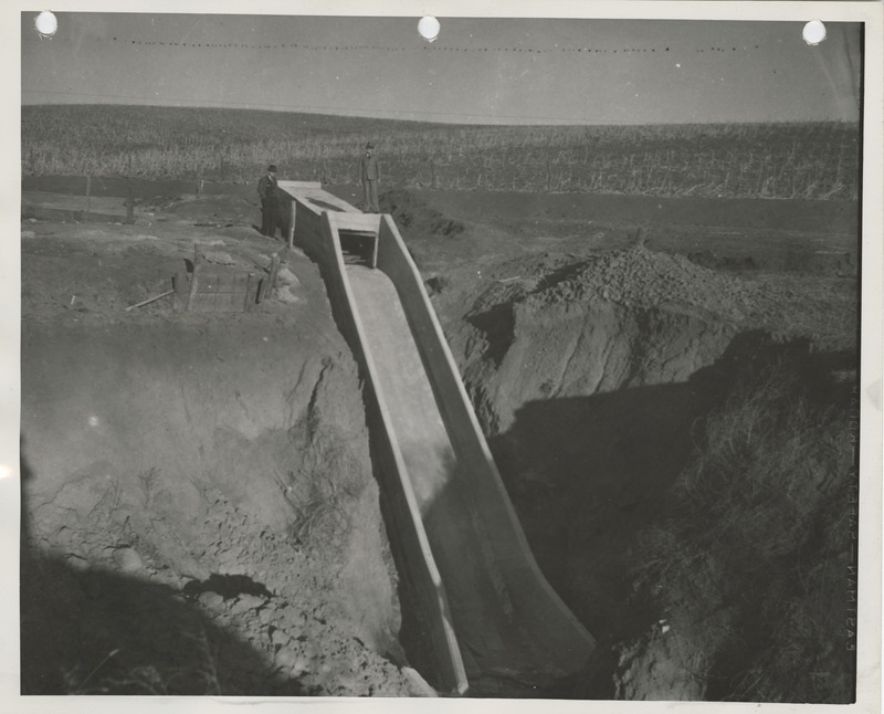 Photograph of people standing by a culvert in Guthrie County
