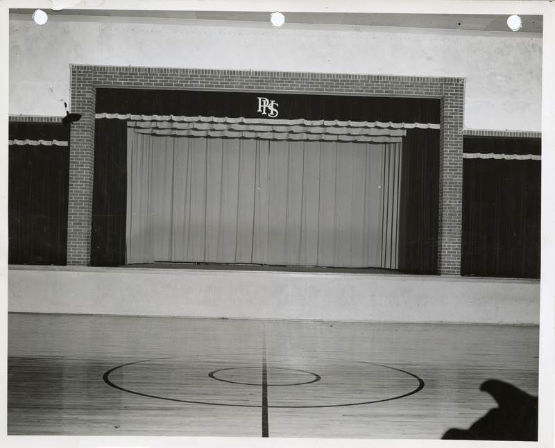 Photograph of the stage at the high school gym in Panora