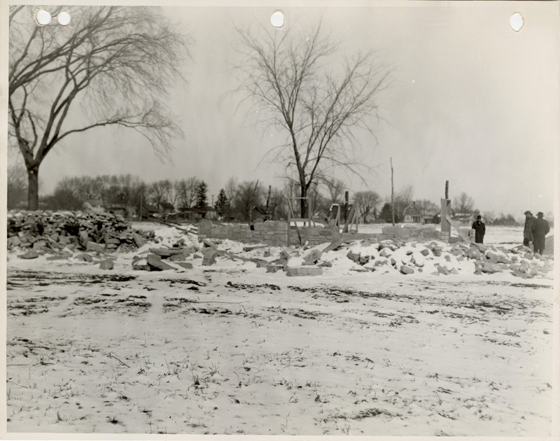 Photograph of people constructing a shelter house in New Sharon