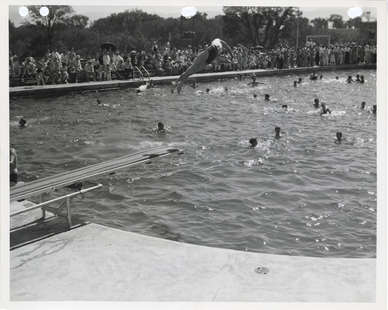 Photograph of people at the diving board and swimming pool at Edmundson Park in Oskaloosa
