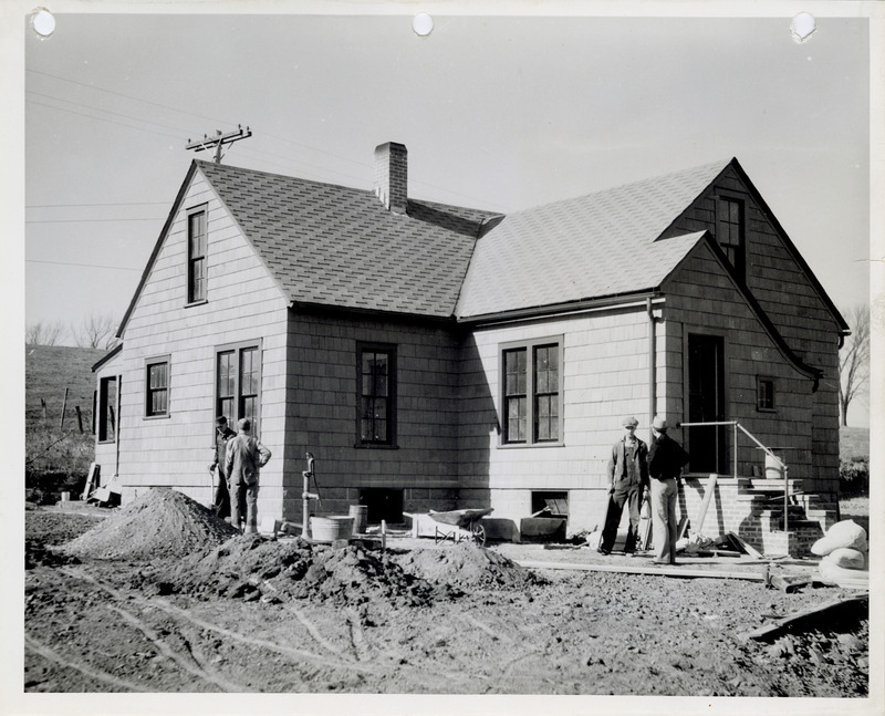 Photograph of people remodeling a caretaker's home at the sewage disposal plant in Oskaloosa