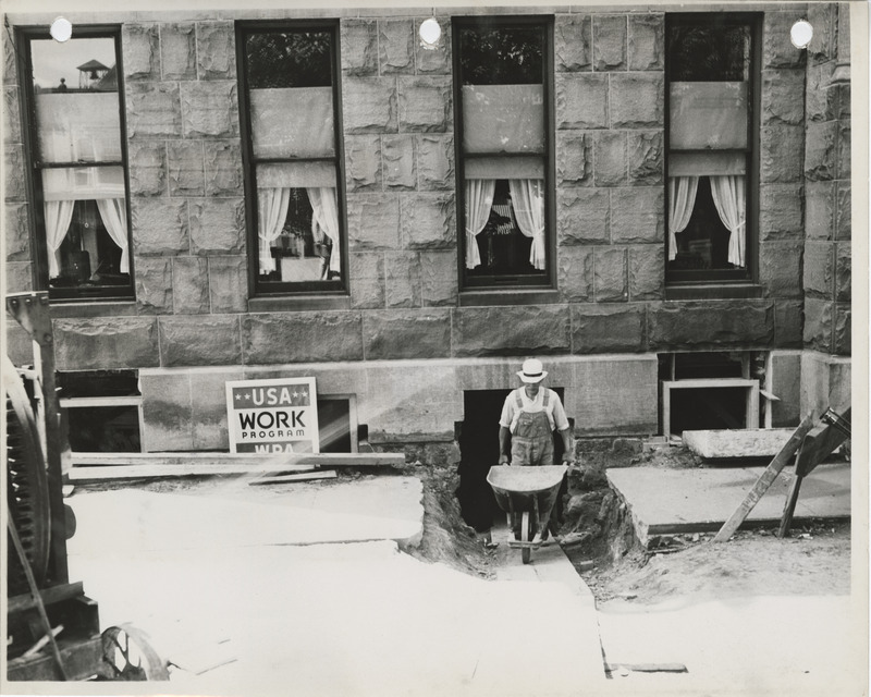 Photograph of person repairing the county courthouse in Knoxville