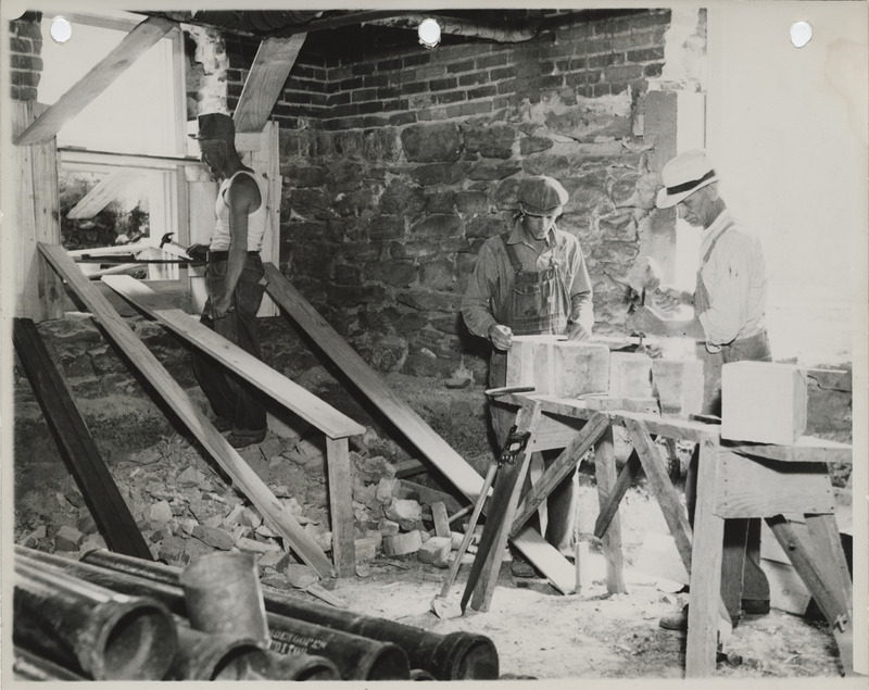 Photograph of people repairing the county courthouse in Knoxville