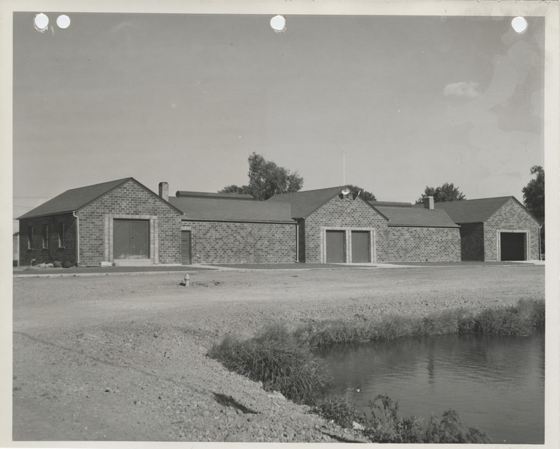 Photograph of a bathhouse and shelter house at a city park in Pella