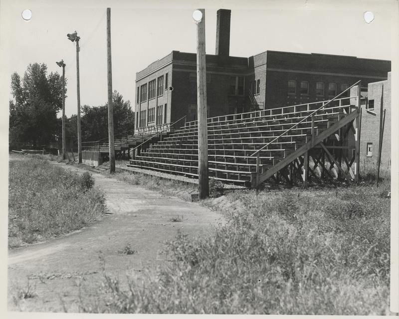 Photograph of a running track and rebuilt bleachers at a high school in Albia