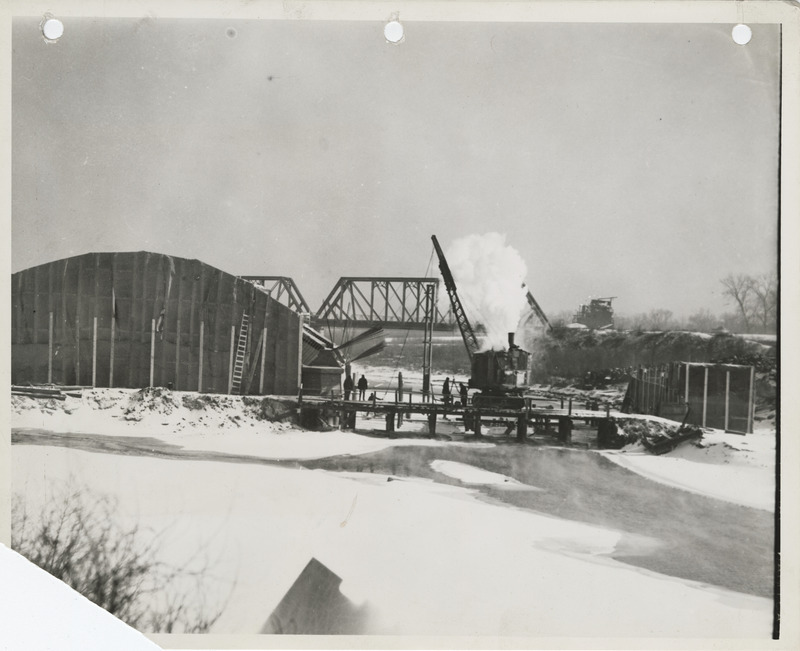 Photograph of the construction of a river bridge in Des Moines