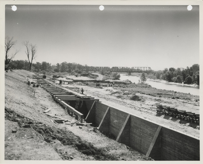 Photograph of the construction of a river wall in Des Moines