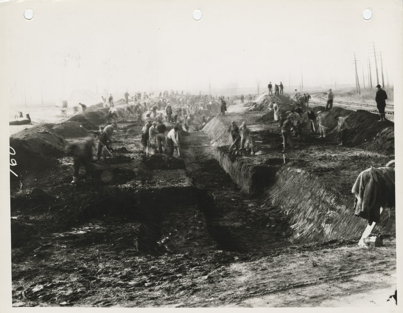 Photograph of people constructing a sanitary and storm sewer at E 18th and Dean Ave. in Des Moines