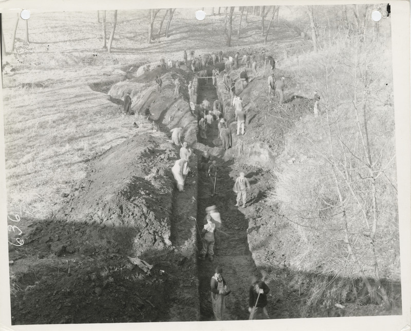 Photograph of people constructing a sewer at 34th and College in Des Moines