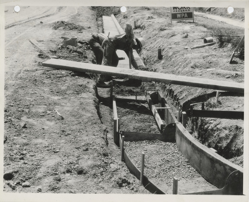 Photograph of people constructing street curbs in Nevada
