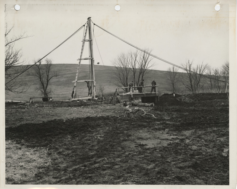 Photograph of the construction of a wood bridge on a farm to market road in Union County