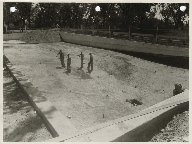 Photograph of men constructing swimming pool in Dunlap