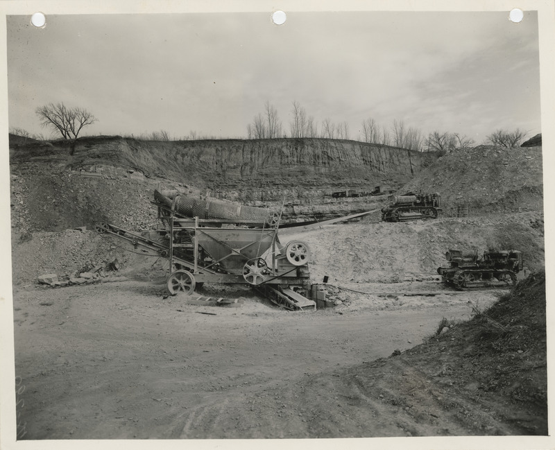 Photograph of equipment crushing rock for the farm-to-market road at the quarry in Thurman