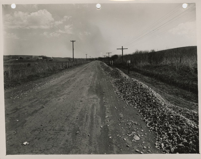 Photograph of farm-to-market road surfacing with crushed rock in Council Bluffs