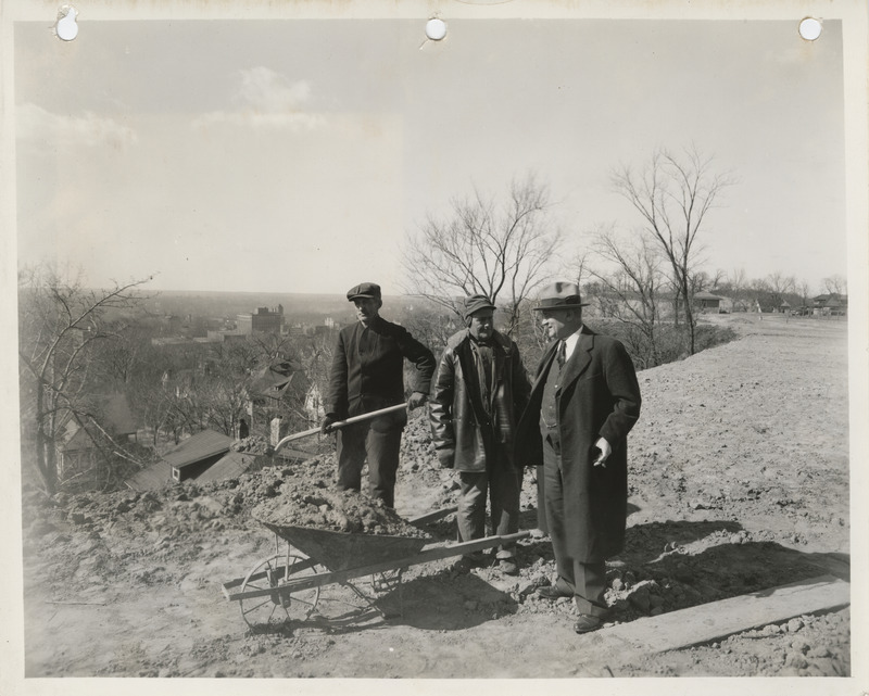 Photograph of people inspecting a hill in Council Bluffs