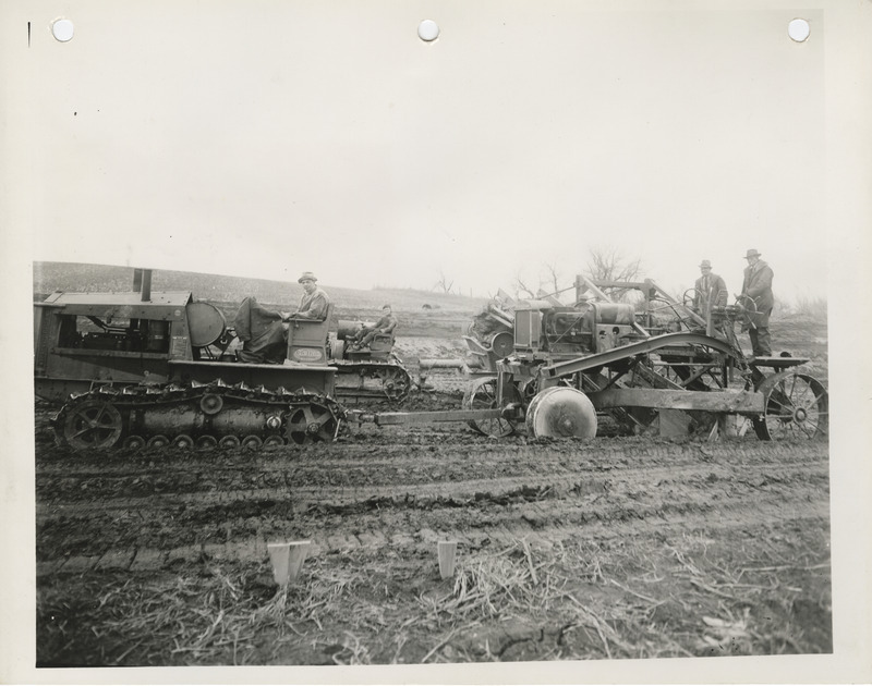 Photograph of people grading a farm to market road in Pottawattamie County