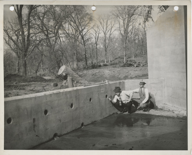 Photograph of two people inspecting culverts at Bedford State Park in Taylor County