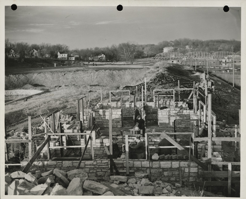 Photograph of people constructing a park building at the university campus in Iowa City
