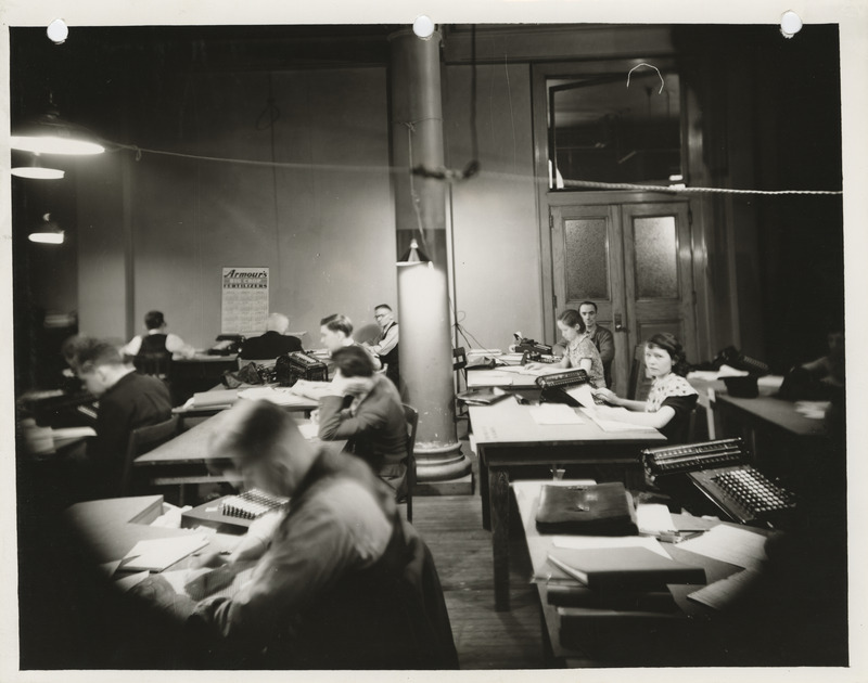 Photograph of people summarizing farm records at 110 Old Federal Building in Des Moines