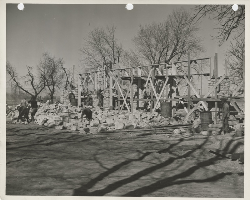 Photograph of people constructing a maintenance garage in Oskaloosa