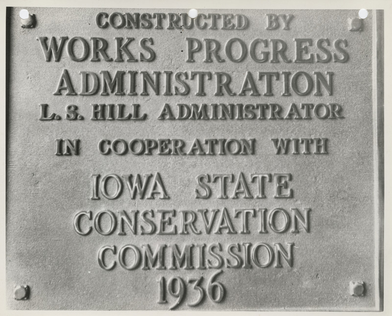 Photograph of the metal plaque placed on the completed sea wall