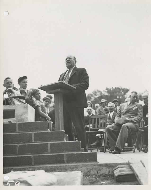Photograph of group of people gathered during the dedication of bathhouse and shelter house in Riverview Park