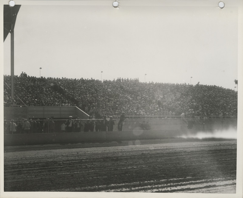 Photograph of people seated on the bleachers at Clay County Fairgrounds during the 1937 fair