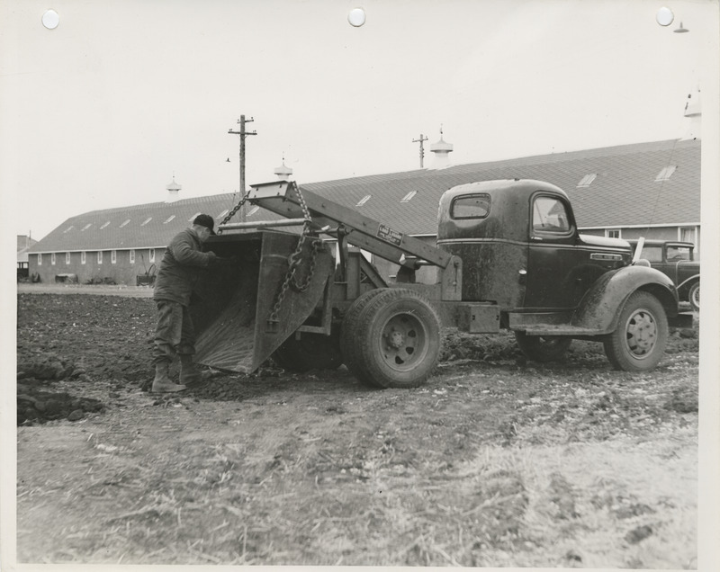 Photograph of load lugger operating in Clay County Fairgrounds