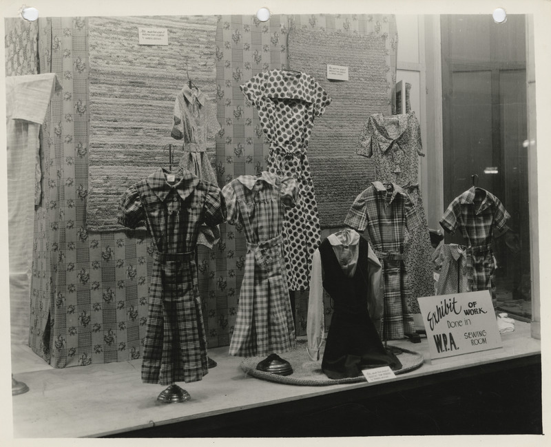 Photograph of the window display of the Dubuque County sewing room