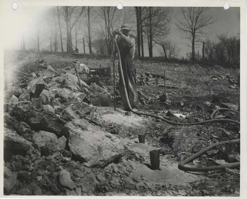 Photograph of a man working at the stone quarry in Louisa County to build farm-to-market roads