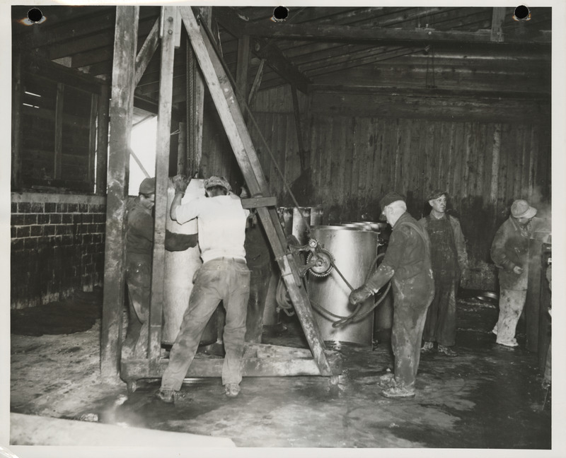 Photograph of men working at the cement tile plant in Marshalltown to build farm-to-market roads