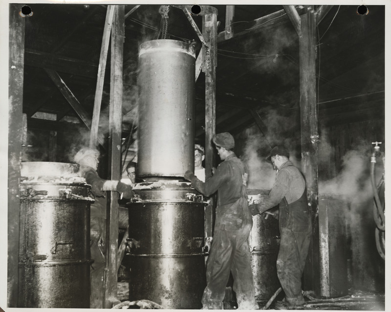 Photograph of men working at the cement tile plant in Marshalltown to build farm-to-market roads