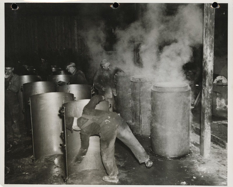 Photograph of men working at the cement tile plant in Marshalltown to build farm-to-market roads