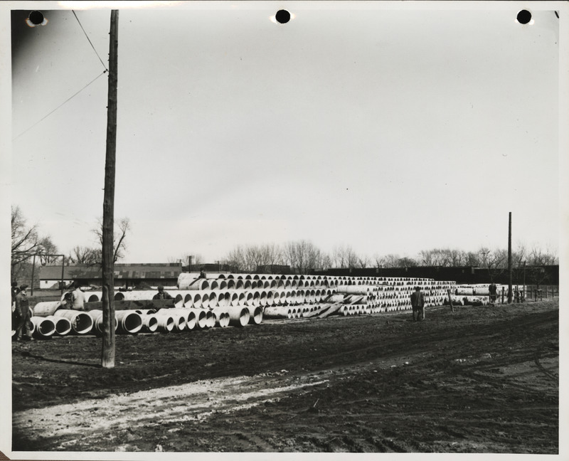 Photograph of men working at the cement tile plant in Marshalltown to build farm-to-market roads