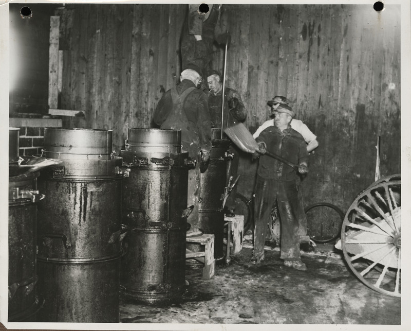 Photograph of men working at the cement tile plant in Marshalltown to build farm-to-market roads
