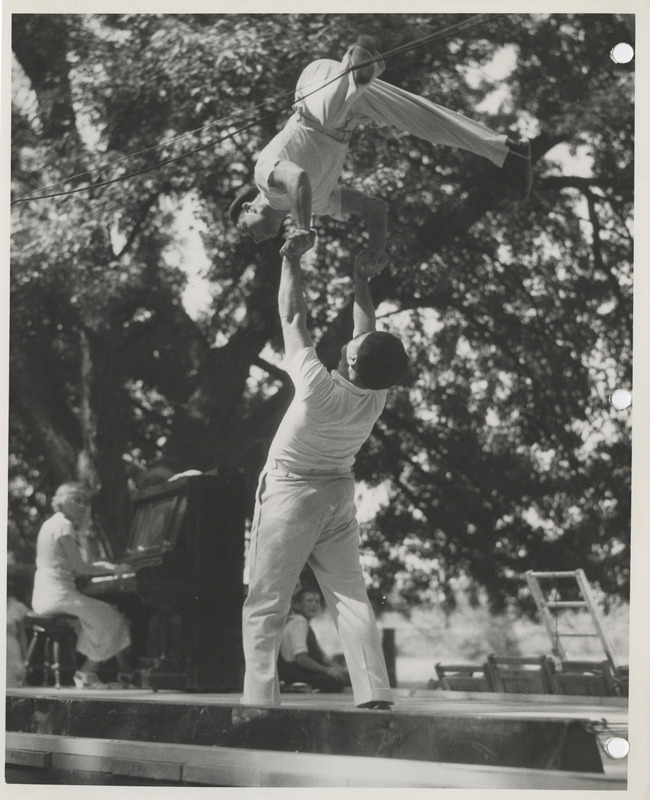Photograph of actors and musicians performing