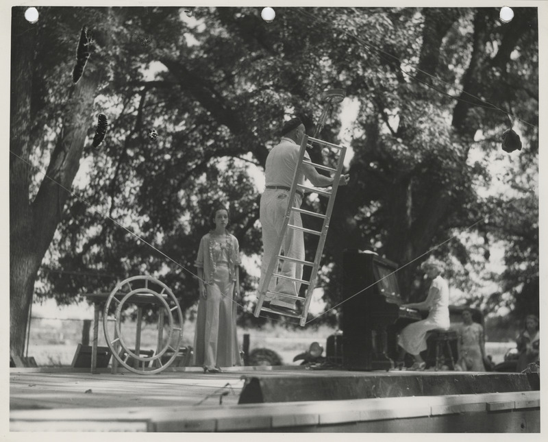 Photograph of actors and musicians performing