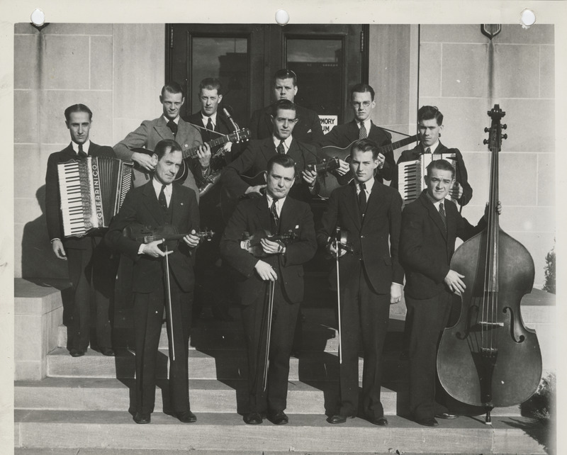 Photograph of group of musicians with their musical instruments