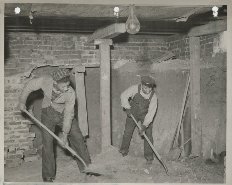 Photograph of two people working at the East Side Community House in Des Moines