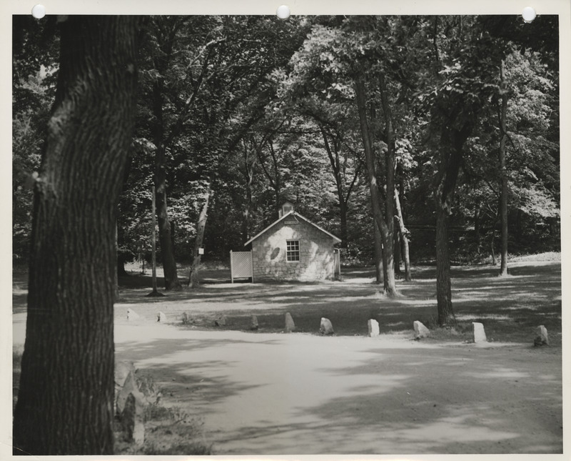 Photograph of a cabin and shelter house at Crawford Park in Fort Dodge