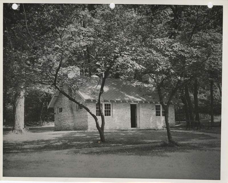 Photograph of a cabin and shelter house at Crawford Park in Fort Dodge