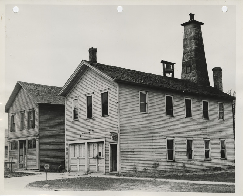 Photograph of buildings that will be razed on the city hall building site in Wilton