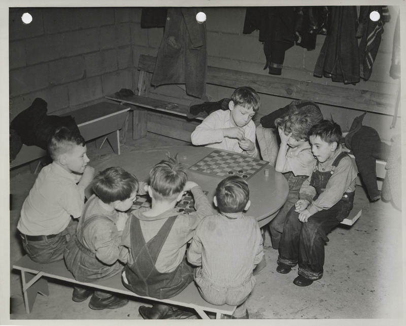 Photograph of children playing checkers in Waterloo
