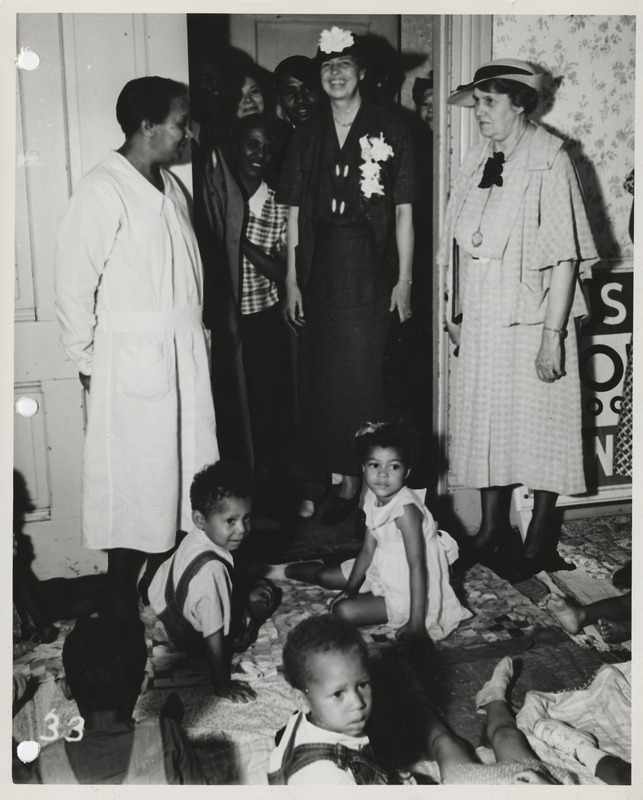 Photograph of Eleanor Roosevelt viewing the nursery at the community center at 15th and Center in Des Moines