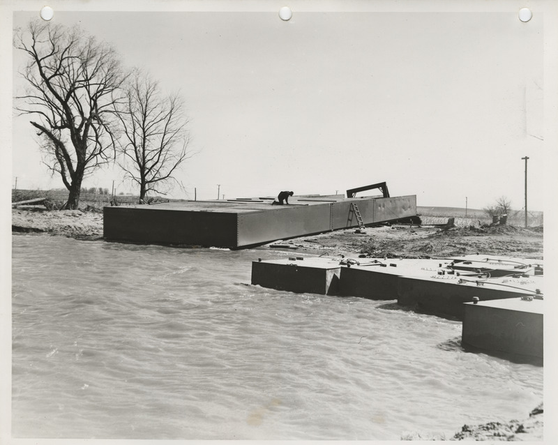 Photograph of a person working on the lake dredging project in Storm Lake
