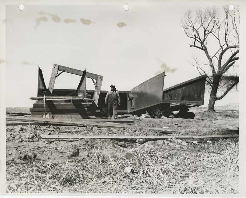 Photograph of a person with dredging equipment in Storm Lake