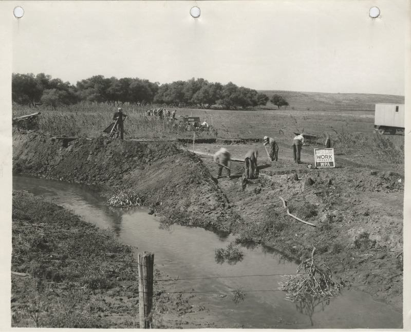 Photograph of people working on a channel change on the Skunk River in Hamilton County