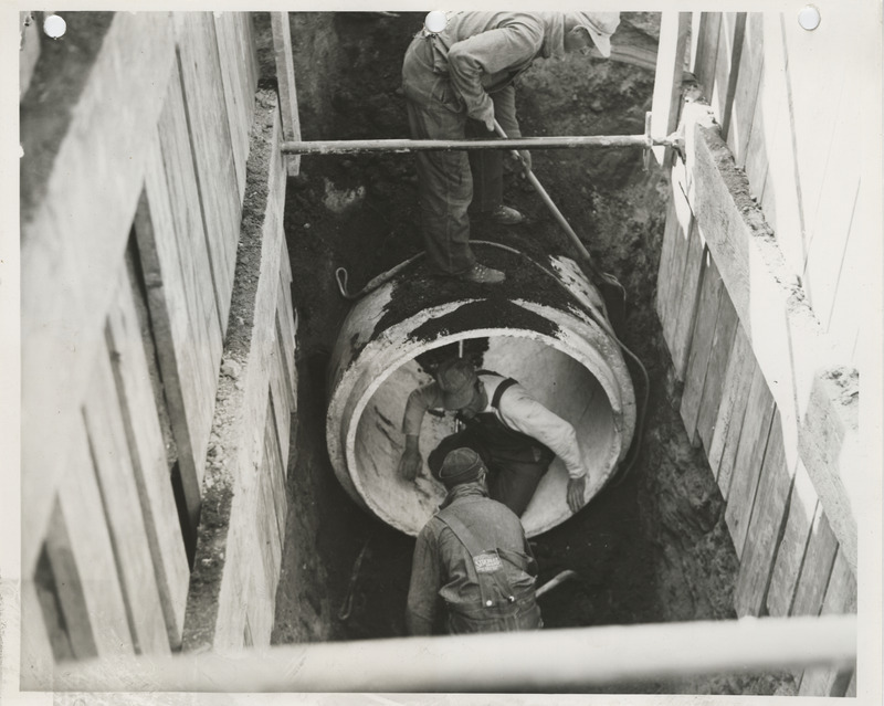 Photograph of people constructing sanitary and storm sewers in Ames
